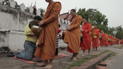 stock-footage-luang-probang-laos-october-bhuddhist-monks-receiving-daily-food-donations-outside-wat